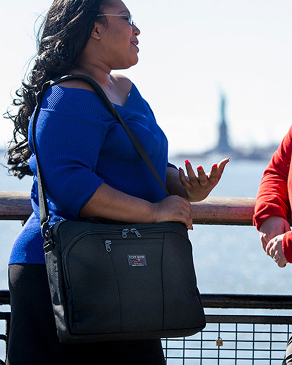 A person holding a conversation while carrying a Cadet.